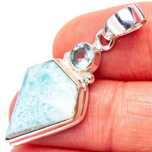 Sterling silver pendant with large light-blue larimar and round blue topaz accents
