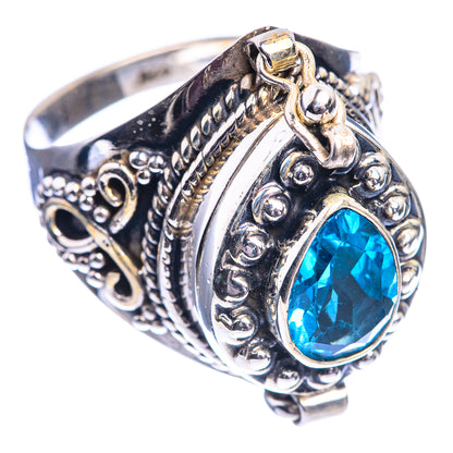 Sterling silver blue topaz oval ring with ornate raised bezel and engraved details