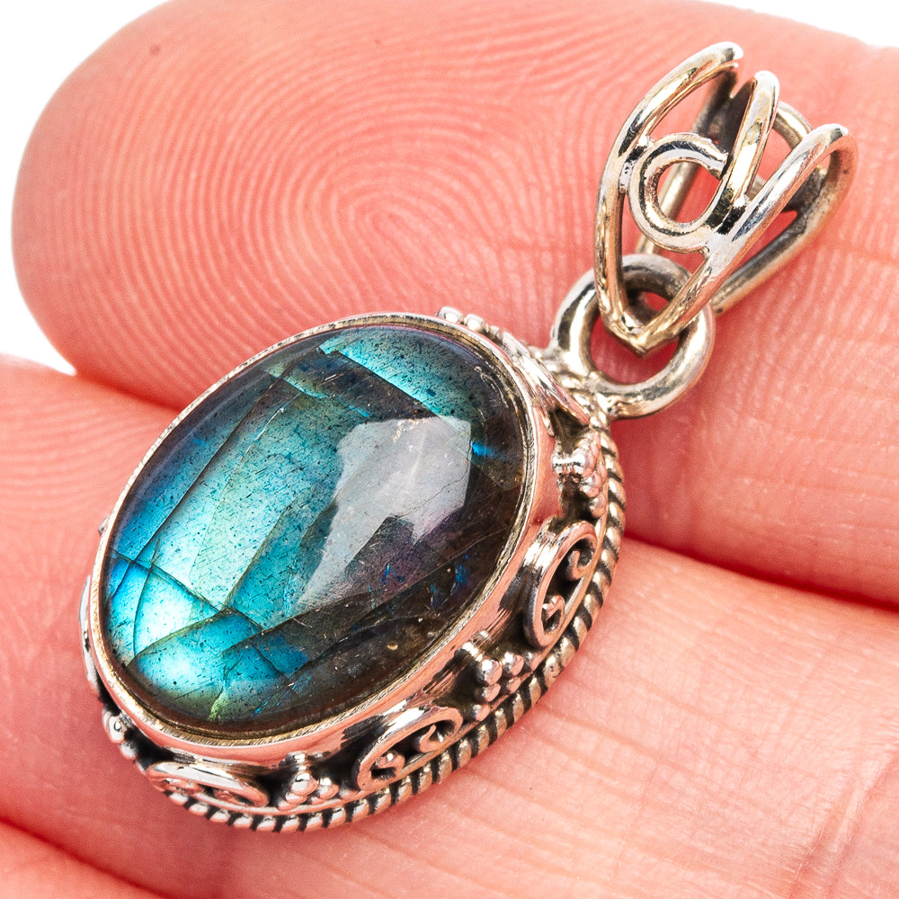 Oval labradorite pendant with blue-green shimmer and ornate 925 sterling silver bail