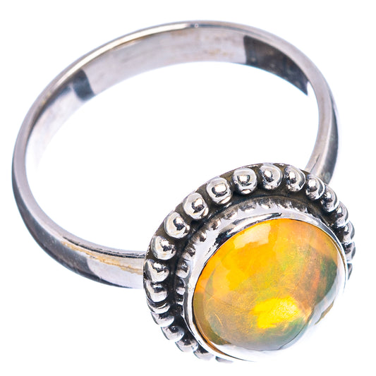 Sterling silver ring with bezel-set oval opal and raised bead-style border