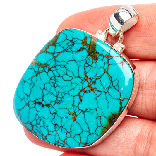 Turquoise oval pendant with .925 sterling silver bail, close-up of webbed stone matrix