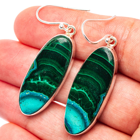 Oval green and teal stone drop earrings with silver hooks and banded pattern
