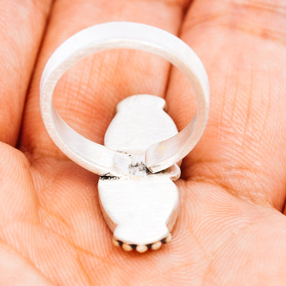 Adjustable sterling silver ring band with open back and oval stone setting