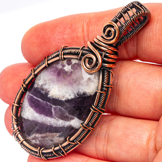 Oxidized copper wire-wrapped amethyst teardrop pendant with spiral wire details