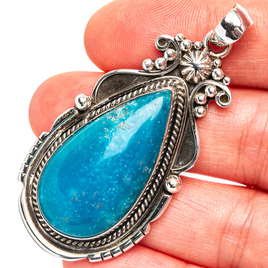 925 sterling silver pendant with turquoise teardrop stone, ornate bezel and bail