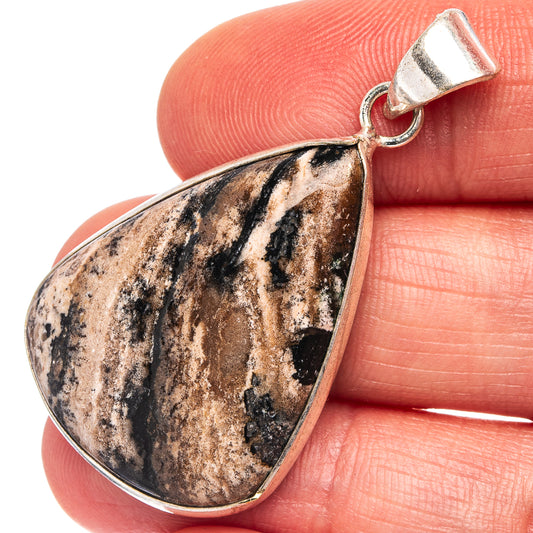 Silver-plated teardrop pendant with black-and-tan dendrite stone, bail loop