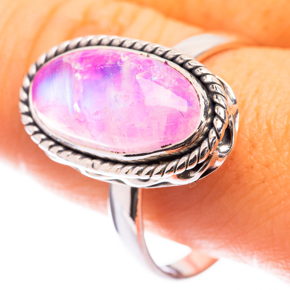 Silver ring with oval pink-purple moonstone cabochon, braided bezel setting