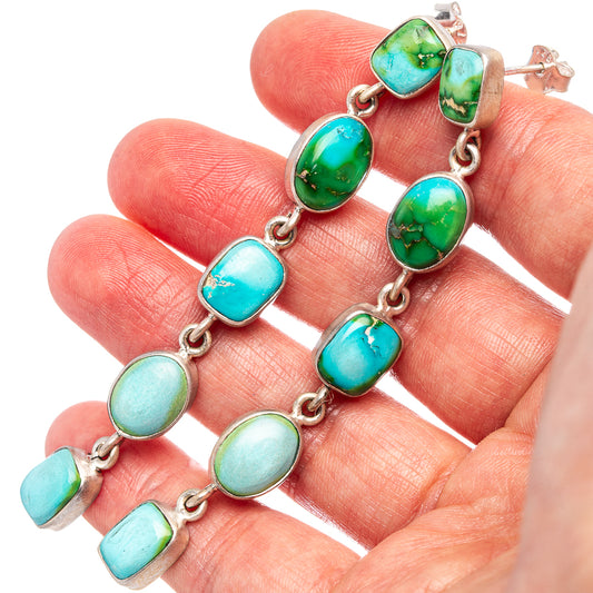 Sterling silver turquoise drop earrings with linked oval stones and lever-back closures