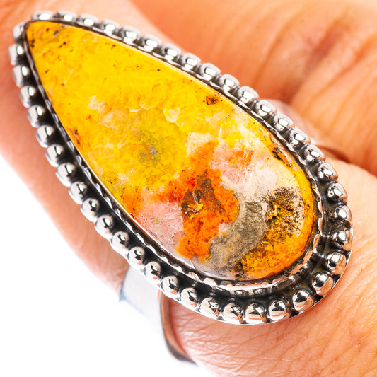 Teardrop amber-orange jasper ring in .925 sterling silver, textured prong bezel