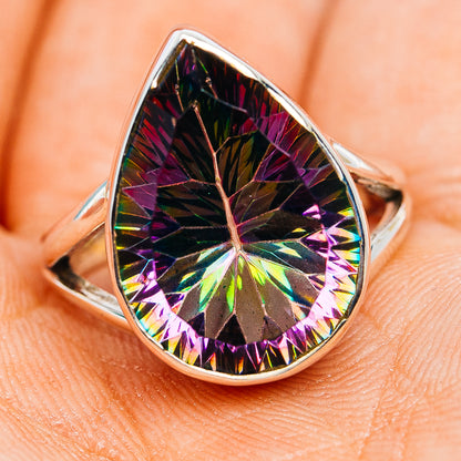 Teardrop sterling silver ring with large rainbow mystic topaz center stone, angled view