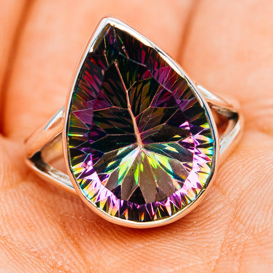 Teardrop sterling silver ring with large rainbow mystic topaz center stone, angled view