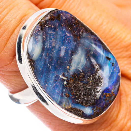 Oval blue boulder opal in a .925 sterling silver ring, close-up on top
