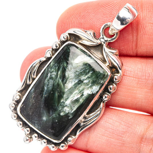 Green seraphinite rectangle pendant with ornate .925 sterling silver frame and bail
