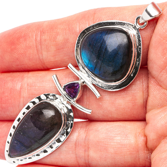 Sterling silver pendant with oval blue labradorite and small amethyst accent