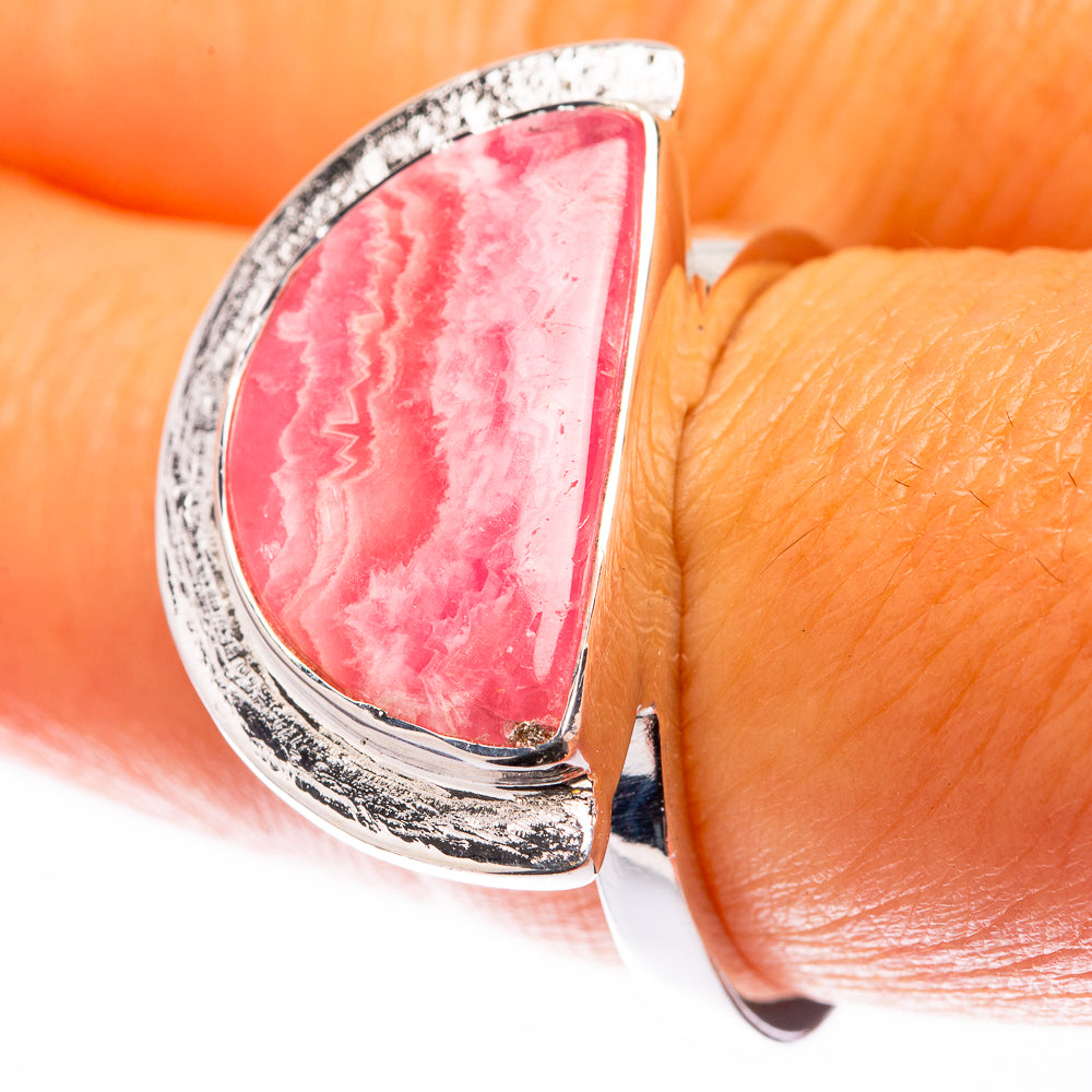 Sterling silver rhodochrosite ring with teardrop pink stone, textured bezel