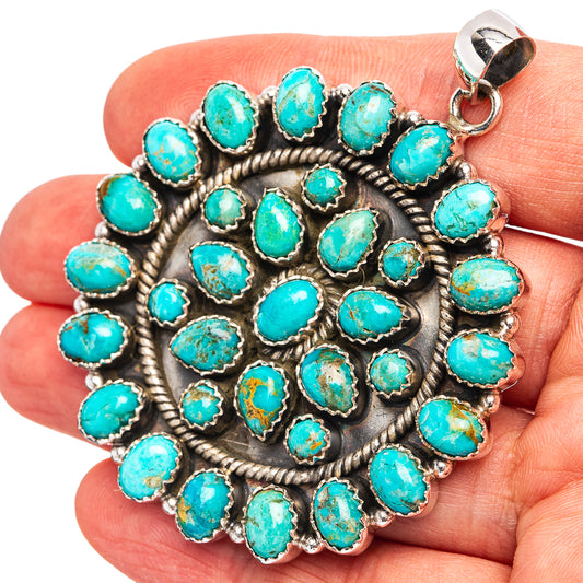 Turquoise and sterling silver circular pendant with rope bezel and silver loop bail
