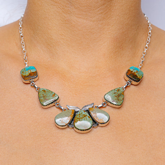 Sterling silver turquoise necklace with oval and teardrop stone charms on chain