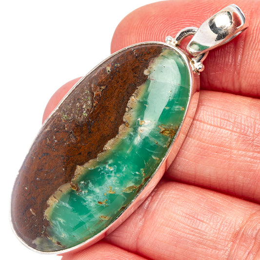 Oval chrysoprase pendant in .925 sterling silver bezel, green stone with brown matrix