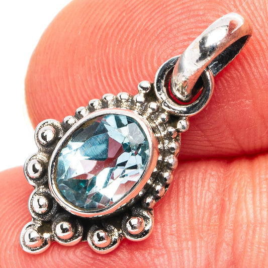 Blue topaz oval pendant in .925 sterling silver with decorative beaded frame