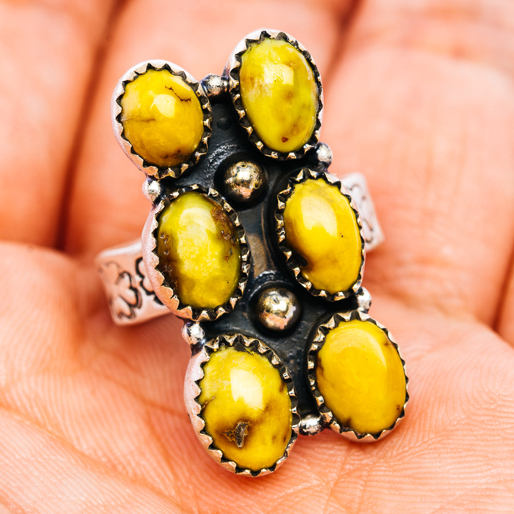 Sterling silver adjustable ring with yellow oval cabochon stones and decorative center dots