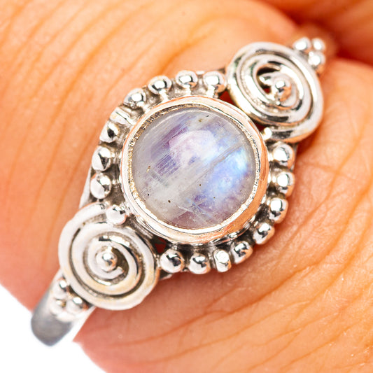Sterling silver moonstone ring with round rainbow cabochon and ornate swirl setting