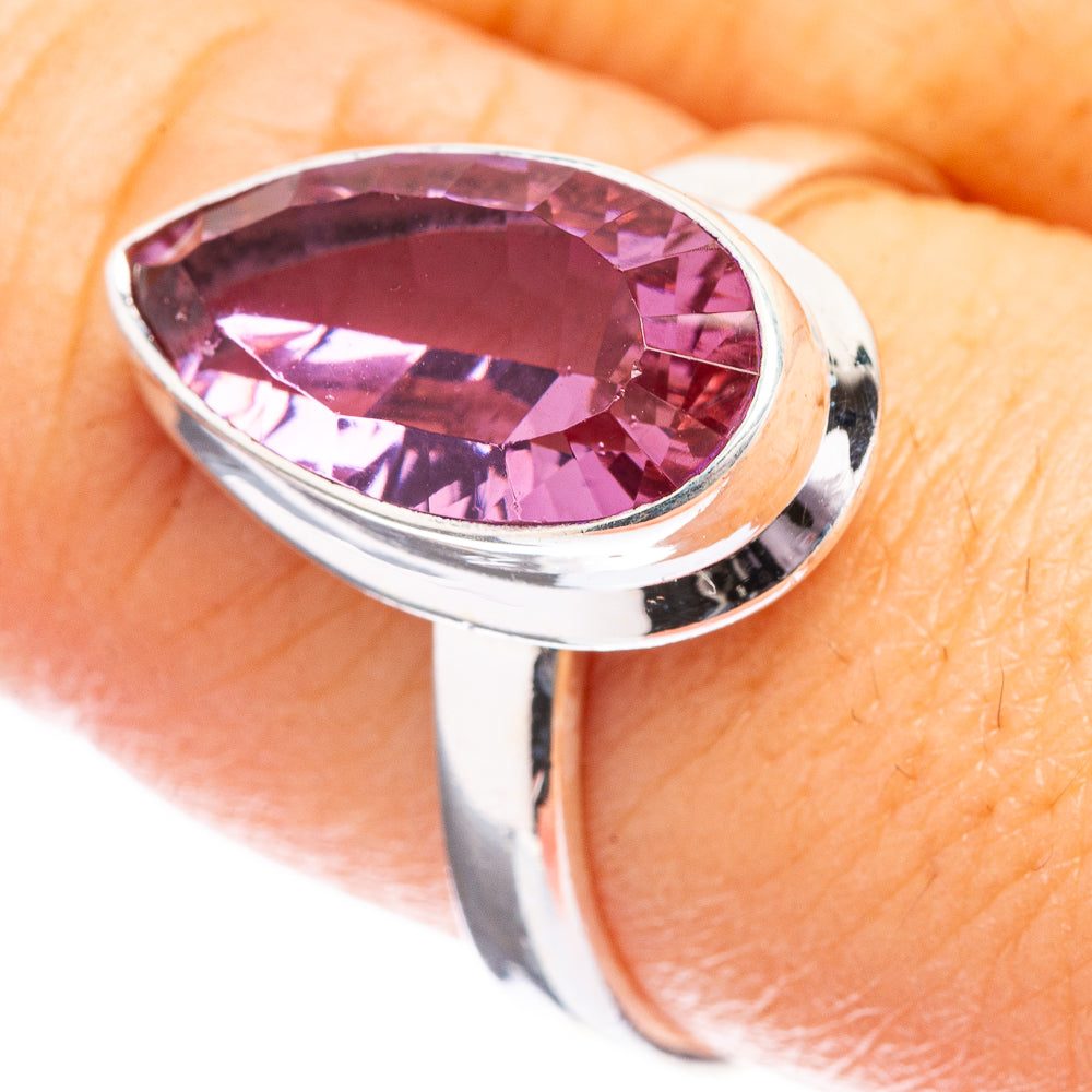 Sterling silver ring with faceted oval color-change gemstone, pink-purple highlights