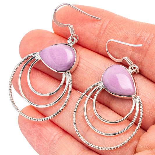 Sterling silver earrings with purple cabochon drops, layered hoops, and chain dangles