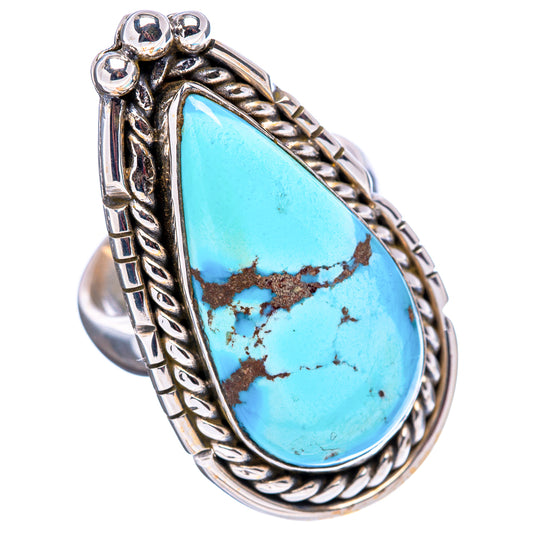 Turquoise teardrop cabochon ring with ornate rope frame and silver chain band