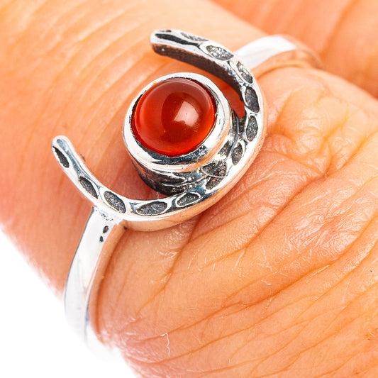 Sterling silver horseshoe ring with red carnelian cabochon, detailed split band