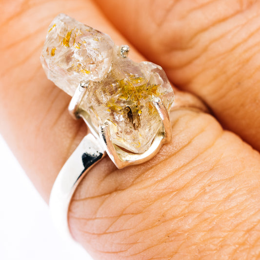 Sterling silver petroleum quartz ring with a large irregular clear stone and golden inclusions