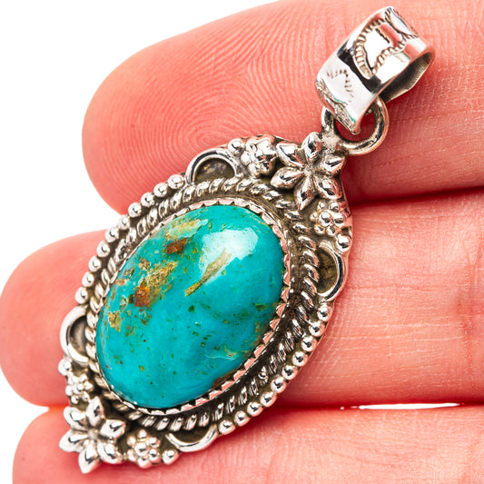 Oval turquoise cabochon sterling silver pendant with ornate beaded bezel and bail