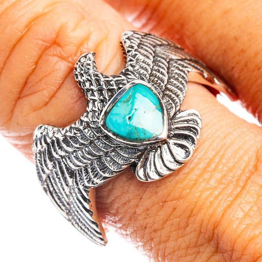 Turquoise eagle sterling silver ring, ornate wings and oval turquoise gemstone on top