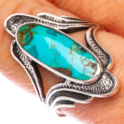 Sterling silver turquoise cabochon ring with oval blue stone and ornate split shoulders