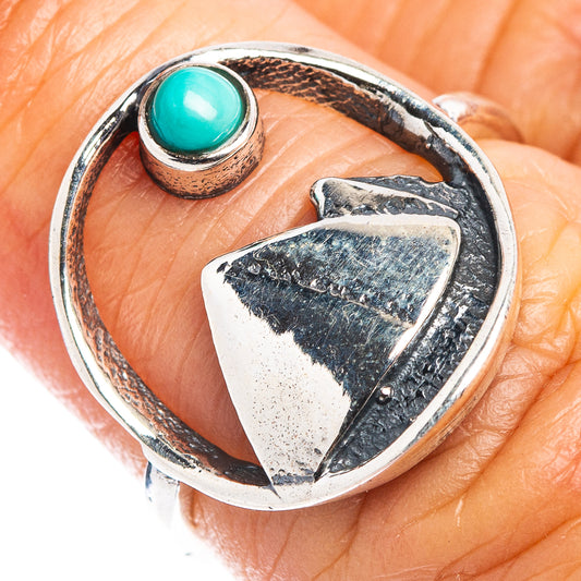 Sterling silver dainty ring with turquoise oval cabochon and openwork heart motif