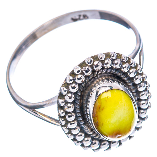 Yellow oval turquoise cabochon ring in .925 sterling silver with beaded outer border, size 6