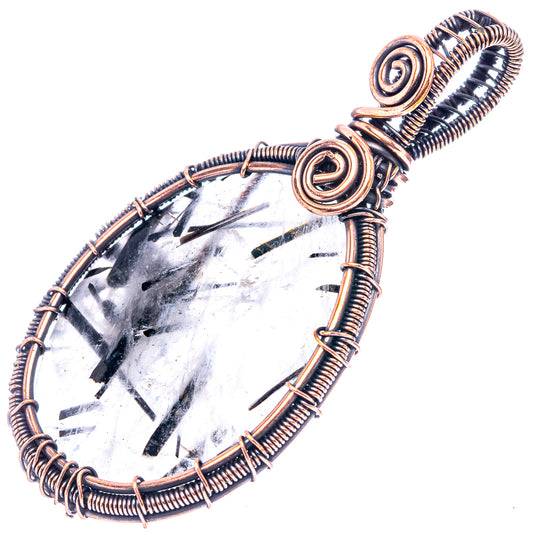 Oxidized copper wire-wrapped teardrop quartz pendant with black tourmaline inclusions and coils