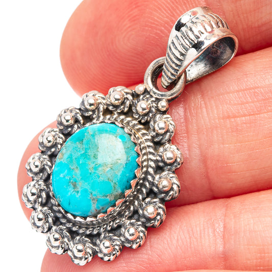 Turquoise oval cabochon pendant with ornate beaded sterling silver frame and rope border