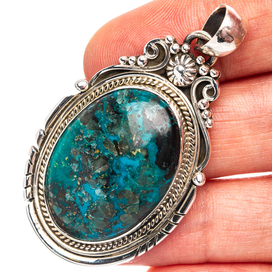 Oval turquoise shattuckite pendant in ornate .925 sterling silver bezel and frame