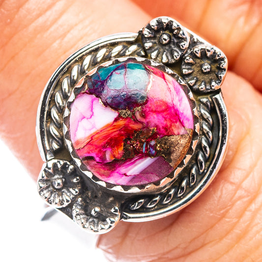 Sterling silver ring with round multicolor cabochon and ornate floral border