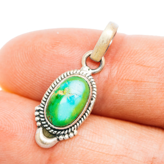 Turquoise oval sterling silver pendant with Southwestern-style bezel and loop