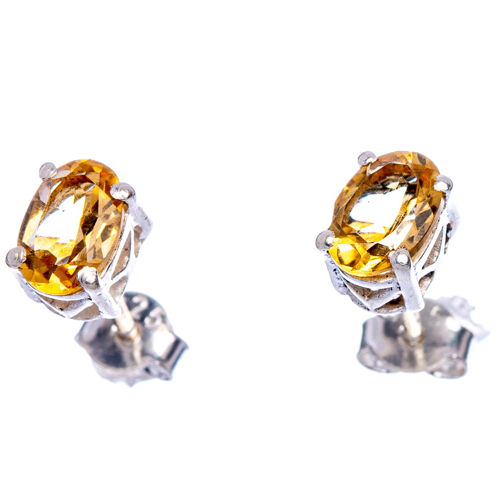 Sterling silver stud earrings with faceted citrine oval gemstones and four prongs
