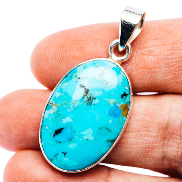 Oval turquoise cabochon pendant in .925 sterling silver with polished bail