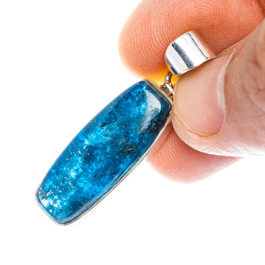 Blue kyanite pendant with silver top bail and bezel around rectangular stone