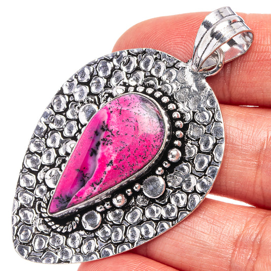 Pink dendritic opal pendant in German silver, teardrop stone with textured silver frame