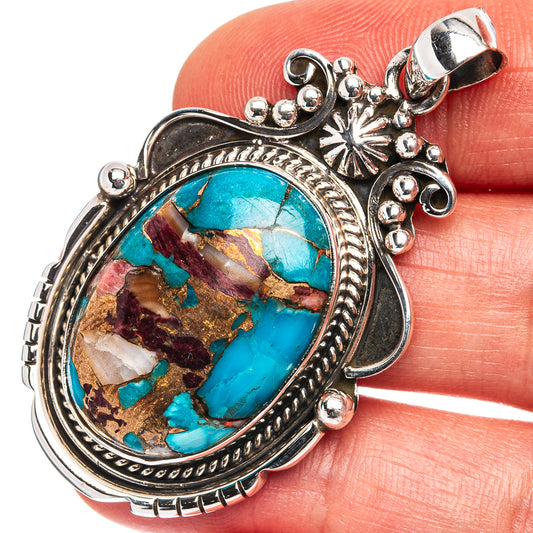 Oval turquoise coral matrix pendant in .925 sterling silver with ornate bezel