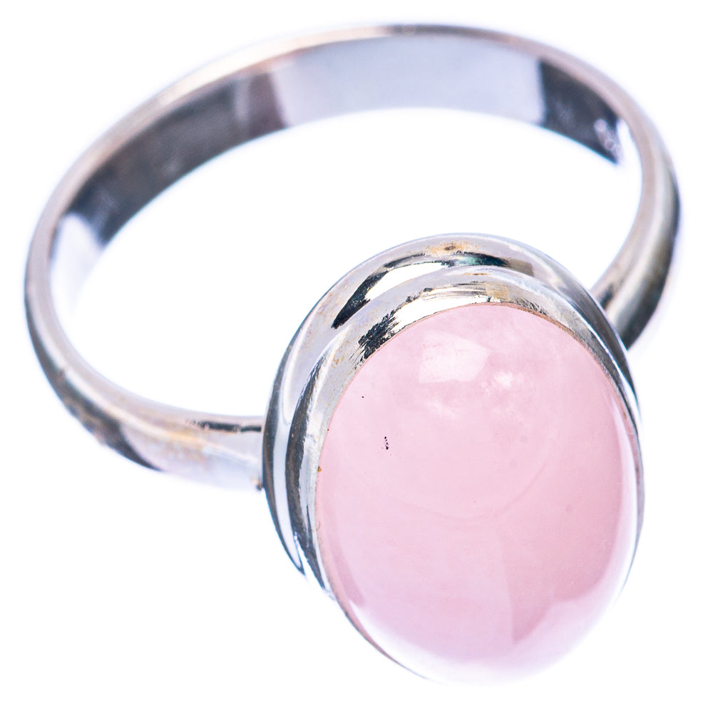 Rare morganite ring showing pink oval stone in silver bezel with round band