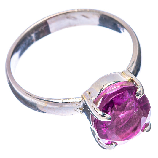 Sterling silver band ring with faceted pink-purple fluorite cushion-cut center stone