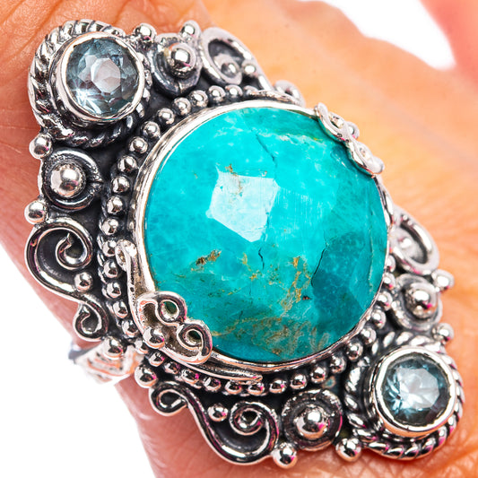 Turquoise oval gemstone ring in .925 sterling silver with blue topaz accents, detailed bezel