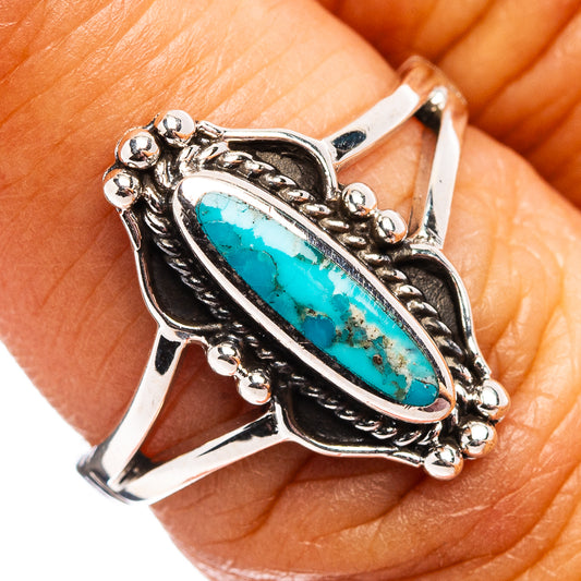 Turquoise oval sterling silver ring with ornate bezel and stone detail