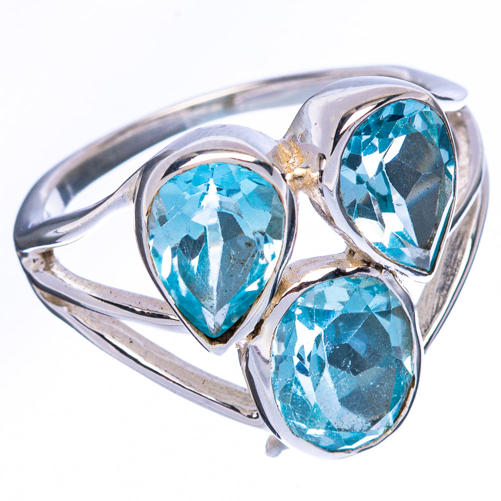 Sterling silver ring with three blue pear-shaped gemstones and curved band detail